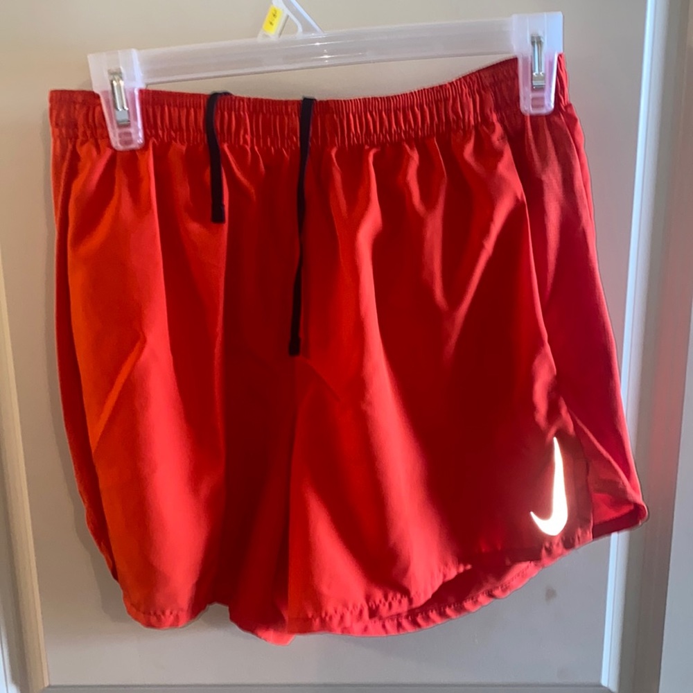 Red/orange Nike athletic shorts. Size M. Lined